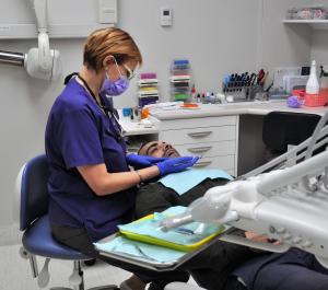 Dentist with patient at the Central Dental Surgery